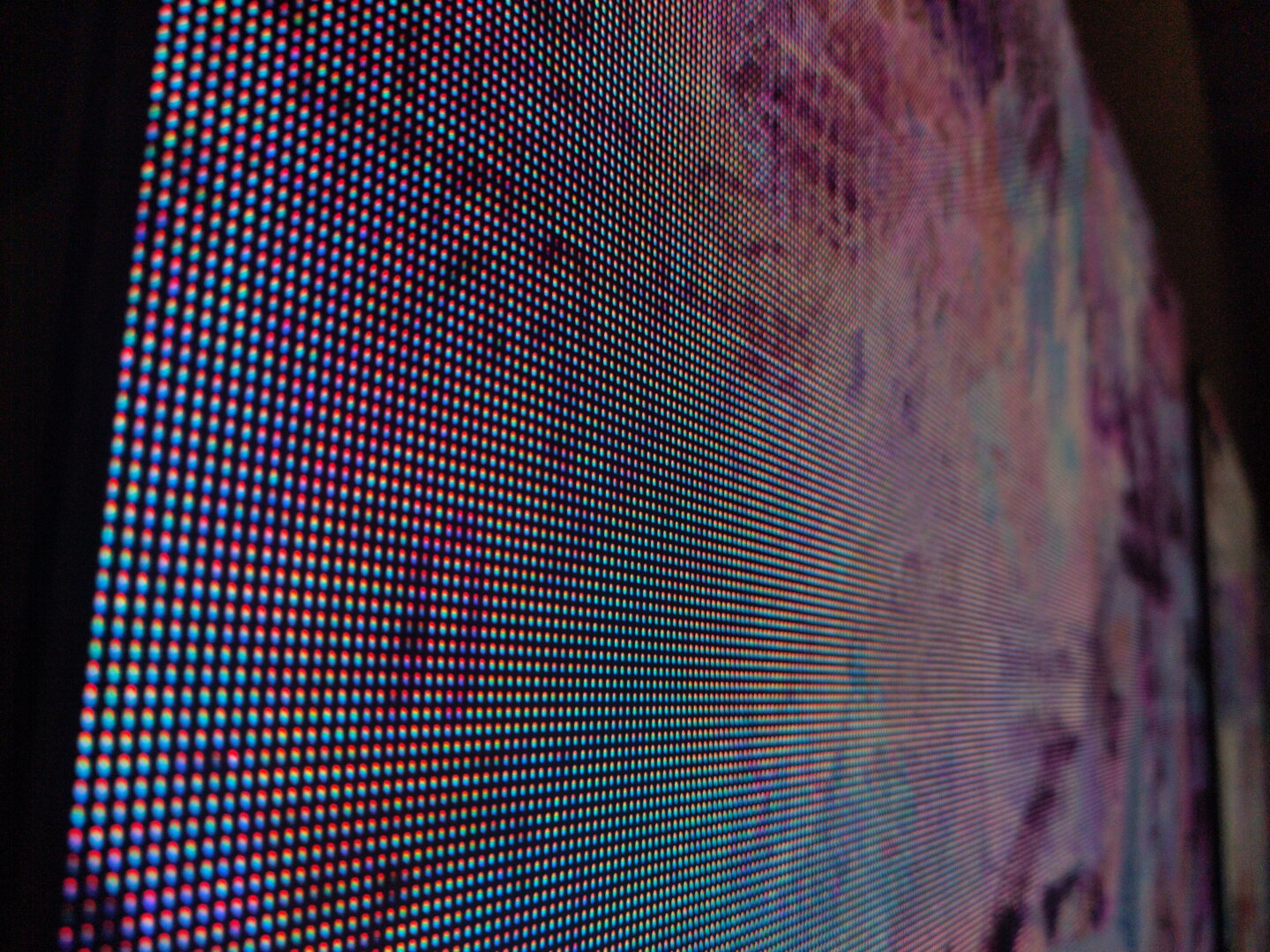 abstract closeup of led screen containing my artwork, beautiful blurry leds, warm pinkish tone